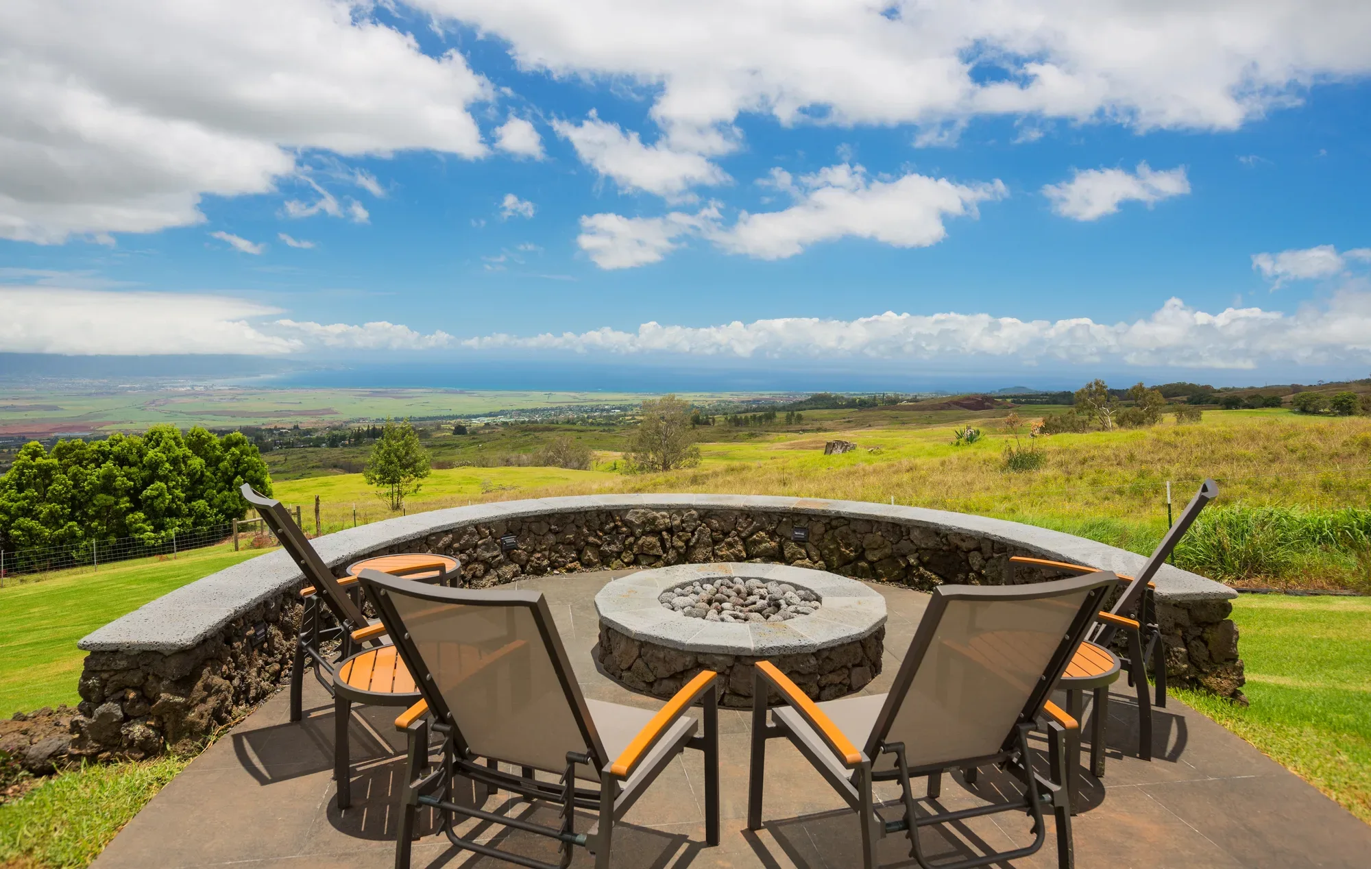 Elevated fire pit patio with a coastal view