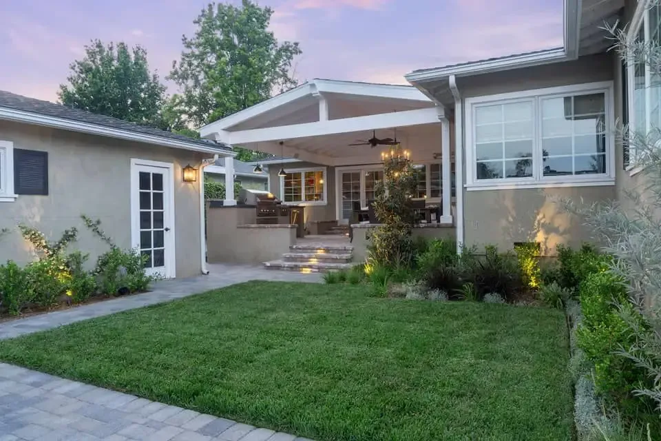 Covered patio with an outdoor kitchen built in underneath