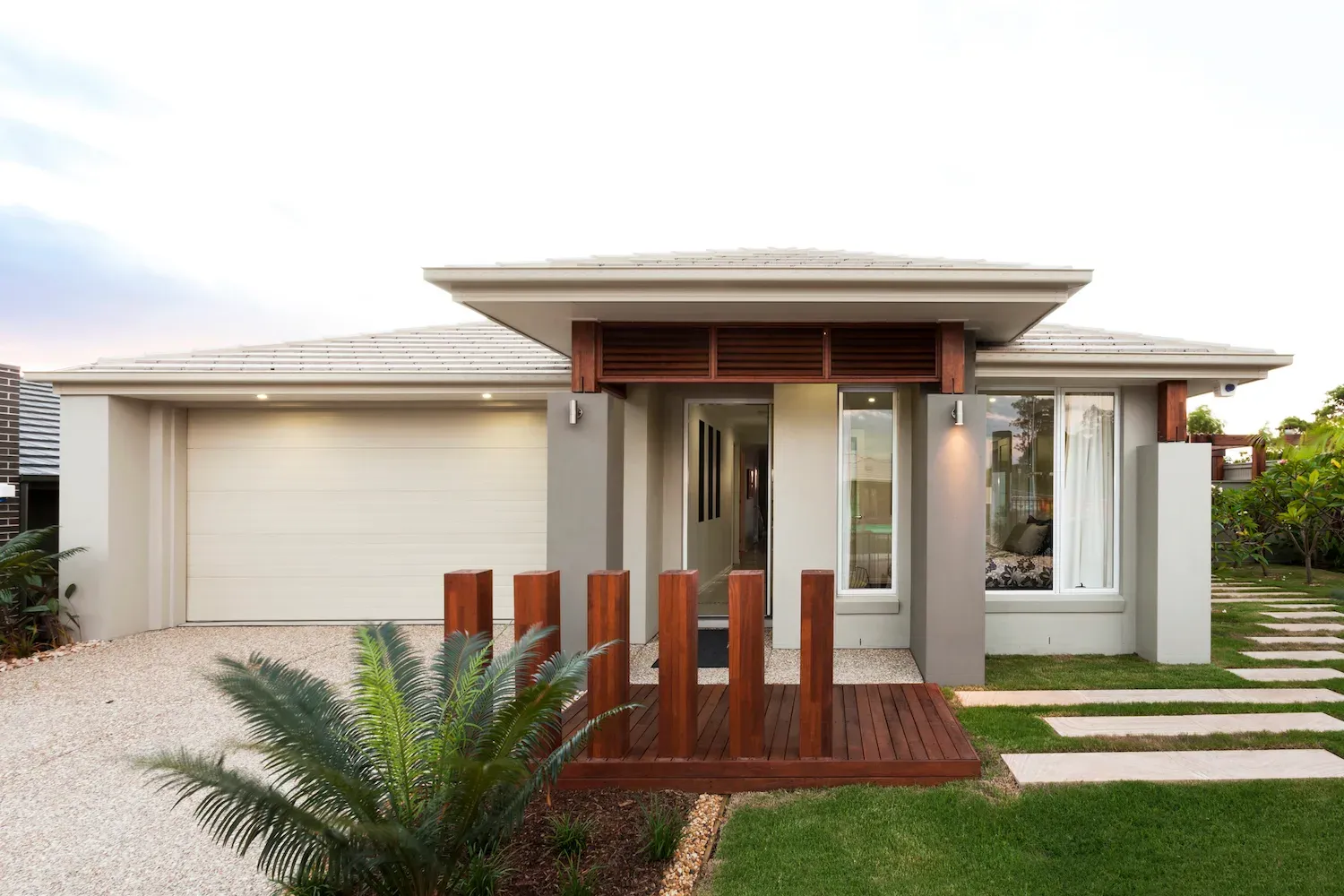 Timber entry deck with feature posts at a Gold Coast home